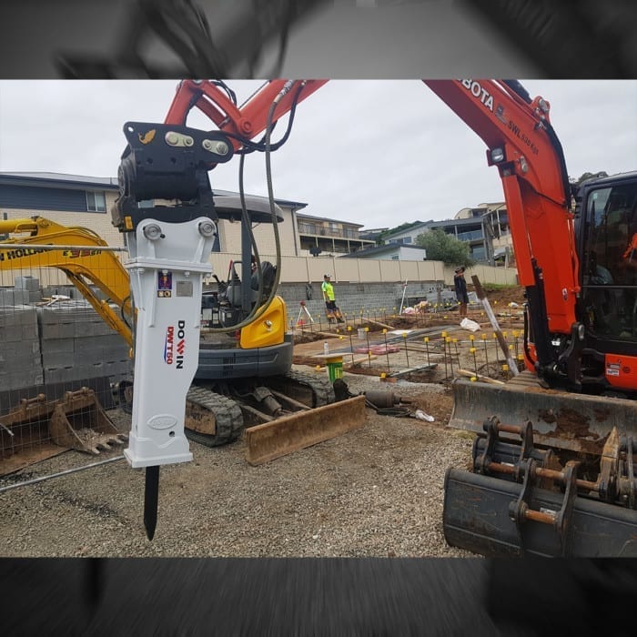 Image of a rock breaker excavator attachment in use